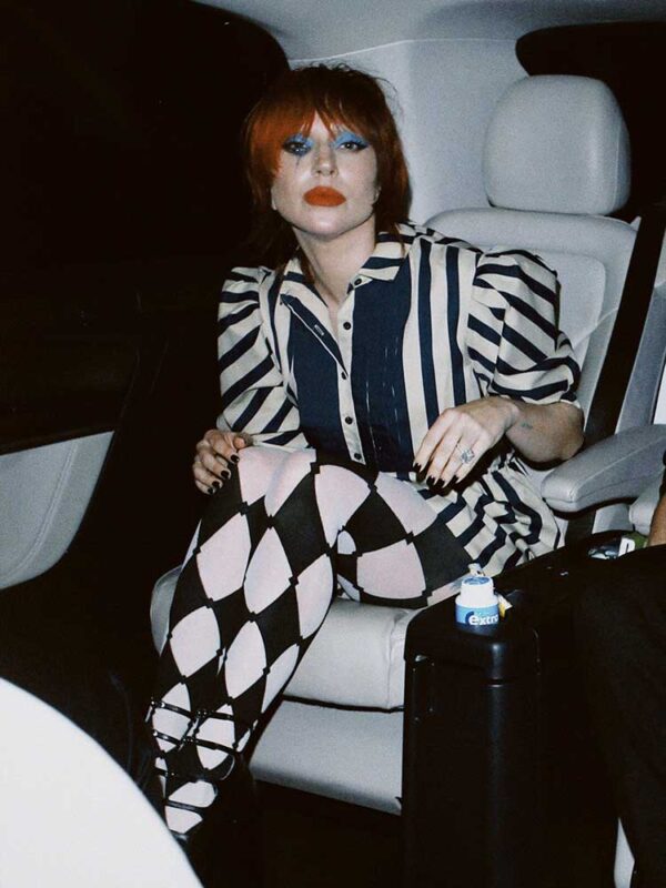 Lady Gaga in a taxi whilst dressed as Harlequin